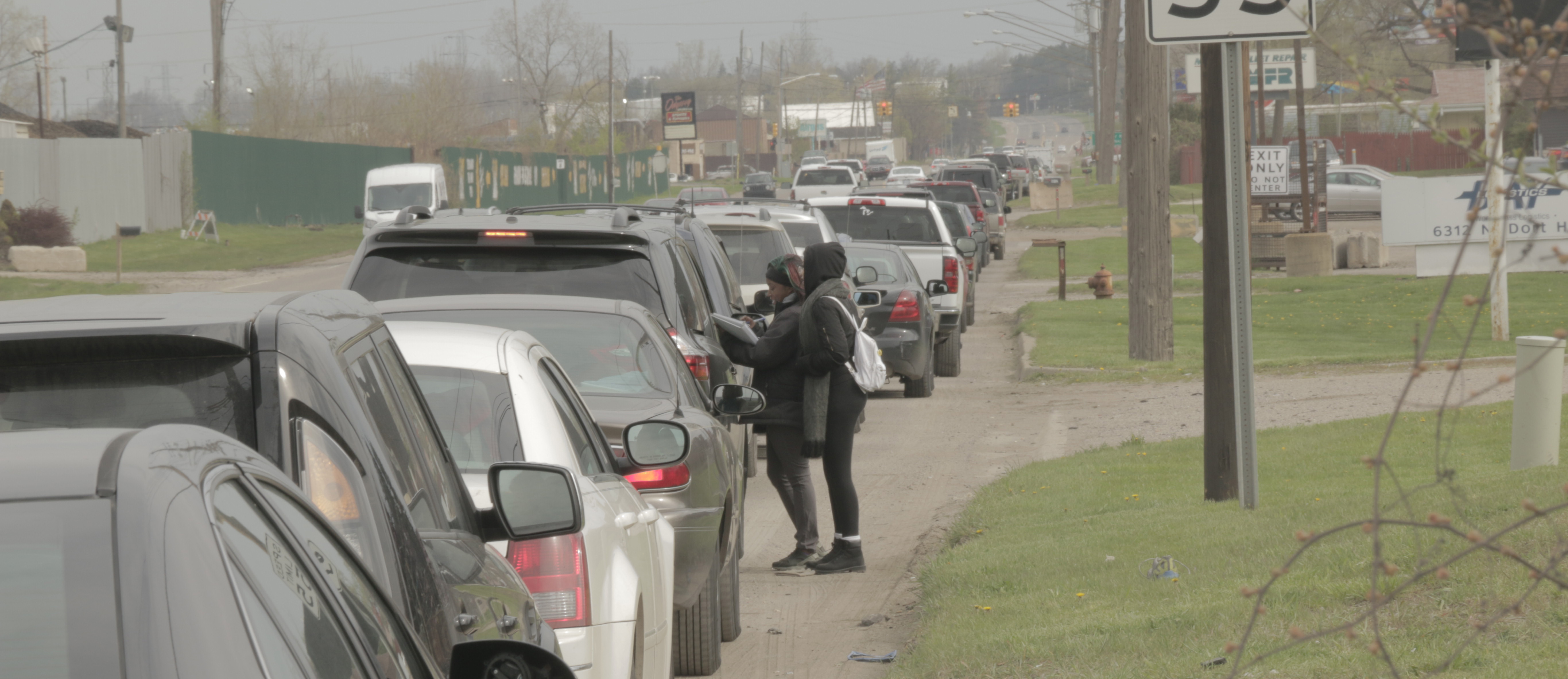 Students talking with Flint residents
